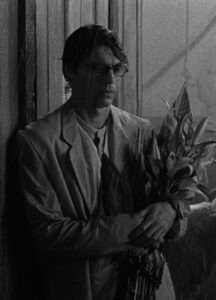 A white man photographed in black and white