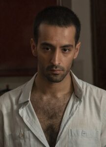 A man wears a white button up