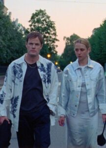 A couple wearing silver clothing