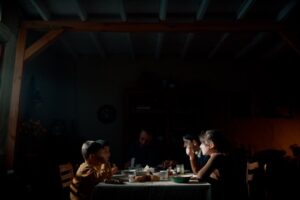 A family gathers around a table