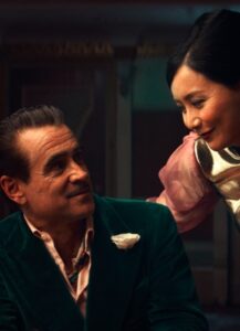 A man and a woman look at each other