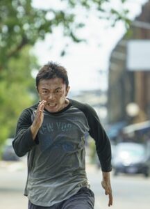 A man is running towards the camera