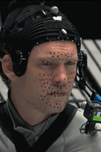 Sam Worthington has dots on his face.