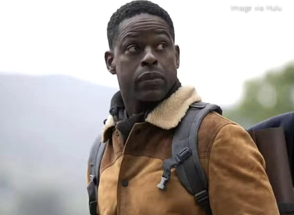 A man wearing a coat and a backpack