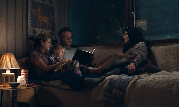 A couple read a book at night