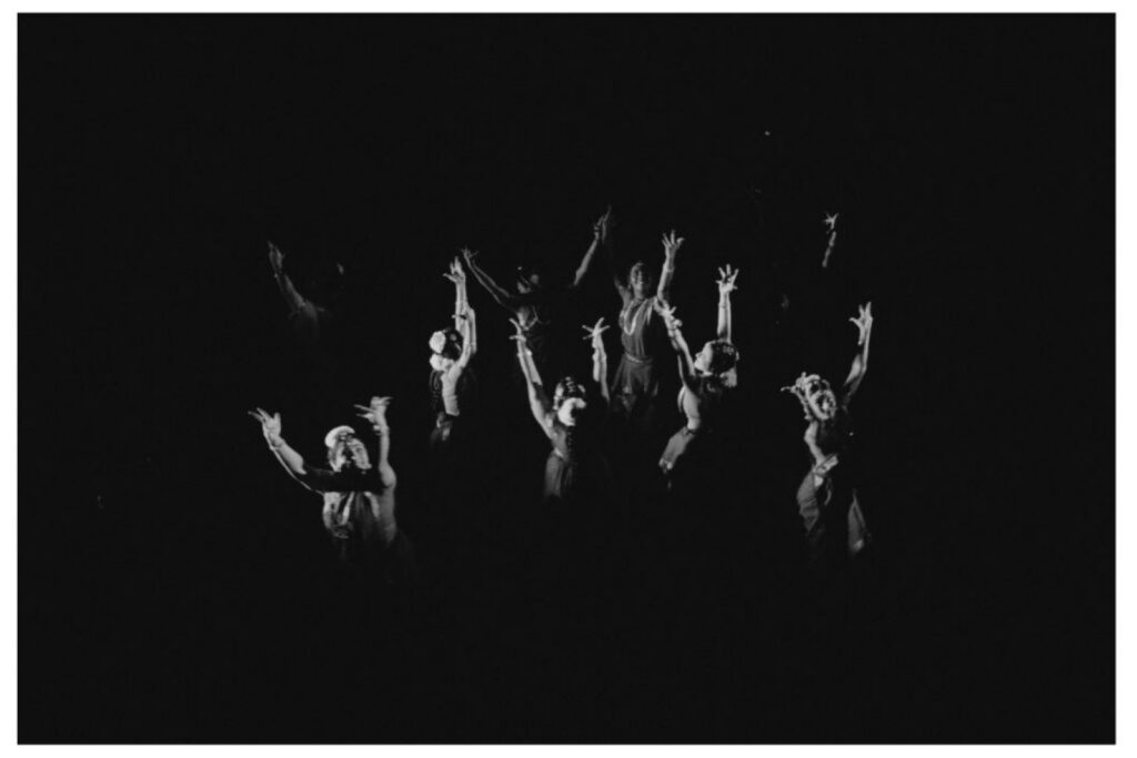A black and white still of dancers