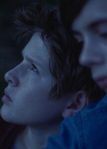 Two boys looking at different directions